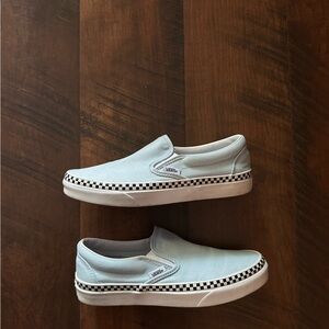 Vans slip on. Light blue with black checkered trim.